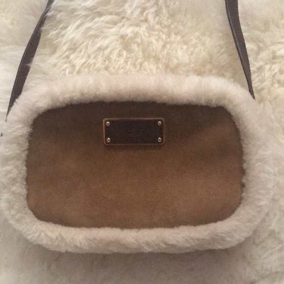 UGG Handbags - UGG Sheldon Crossbody has tags sheepskin suede 9.5 x 6.. flaws but never used